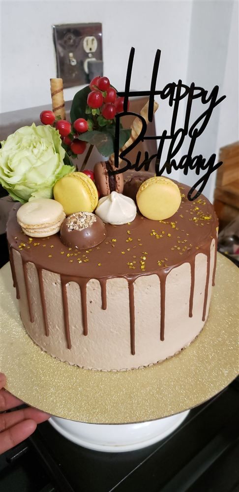 Chocolate drip birthday cake with macarons
