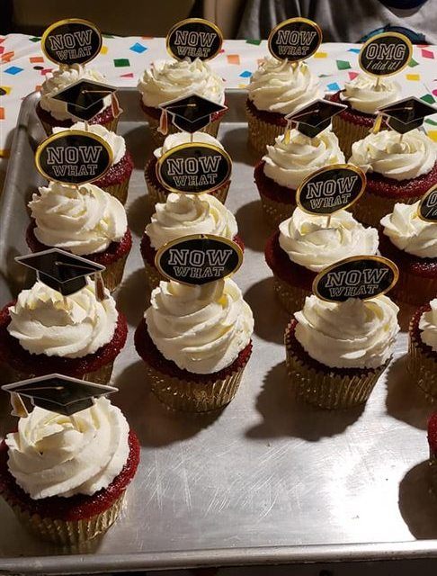 A display of cupcakes with toppers